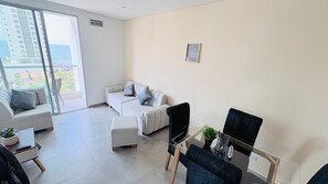 Appartement, balcon, vue plage | Coin séjour