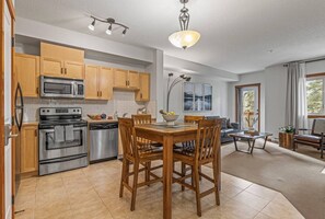 Fridge, microwave, oven, stovetop - Chic 1BR City Nest. Heated Parking + Hot Tub/Pool (Canmore)