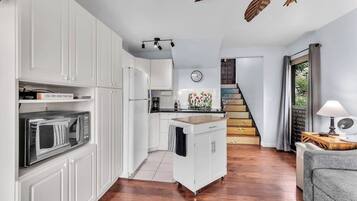 Fridge, microwave, coffee/tea maker, cookware/dishes/utensils