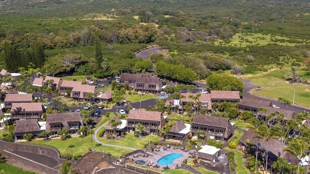 A resort with multiple buildings, a swimming pool, and lush greenery. - #57 Beautifully Remodeled Studio (Pahala)