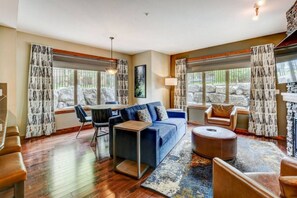 TV, fireplace - Stunning 2BR with Pool, Hot Tub & Gym (Canmore)