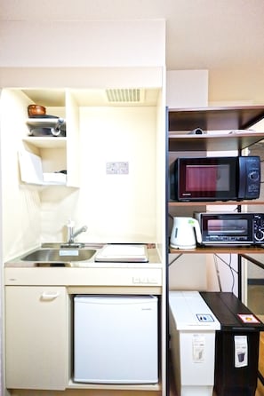 A compact kitchenette with a sink, microwave, toaster, and small refrigerator. - Ikebukuro 5 Min by Train | 16㎡ for 1 | Kitchen, Free Laundry | Fast Wi-Fi (板橋区)