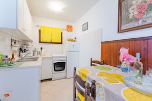 Apartment | Private kitchen | Fridge, microwave, oven, stovetop - Apartments Dada - One-bedroom Apartment With Terrace - (Supetar)