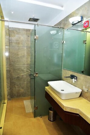 Deluxe Double Room, City View | Bathroom | Hair dryer, slippers, towels, soap - Divine Peak (Pachmarhi)