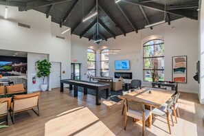 A spacious indoor area with a high ceiling, a fireplace, a television, and a pool table. - Near Diablo Stadium & ASU-HotTub,Pool,Gym,Parking (Tempe)
