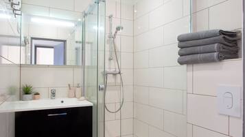 Shower, towels, soap, toilet paper