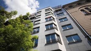 A multi-story building with a modern architectural design, featuring balconies and large windows. - Apartments Belgrade (Belgrade)