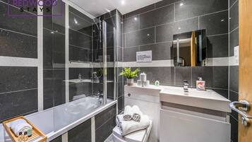 Shower, hair dryer, towels, shampoo