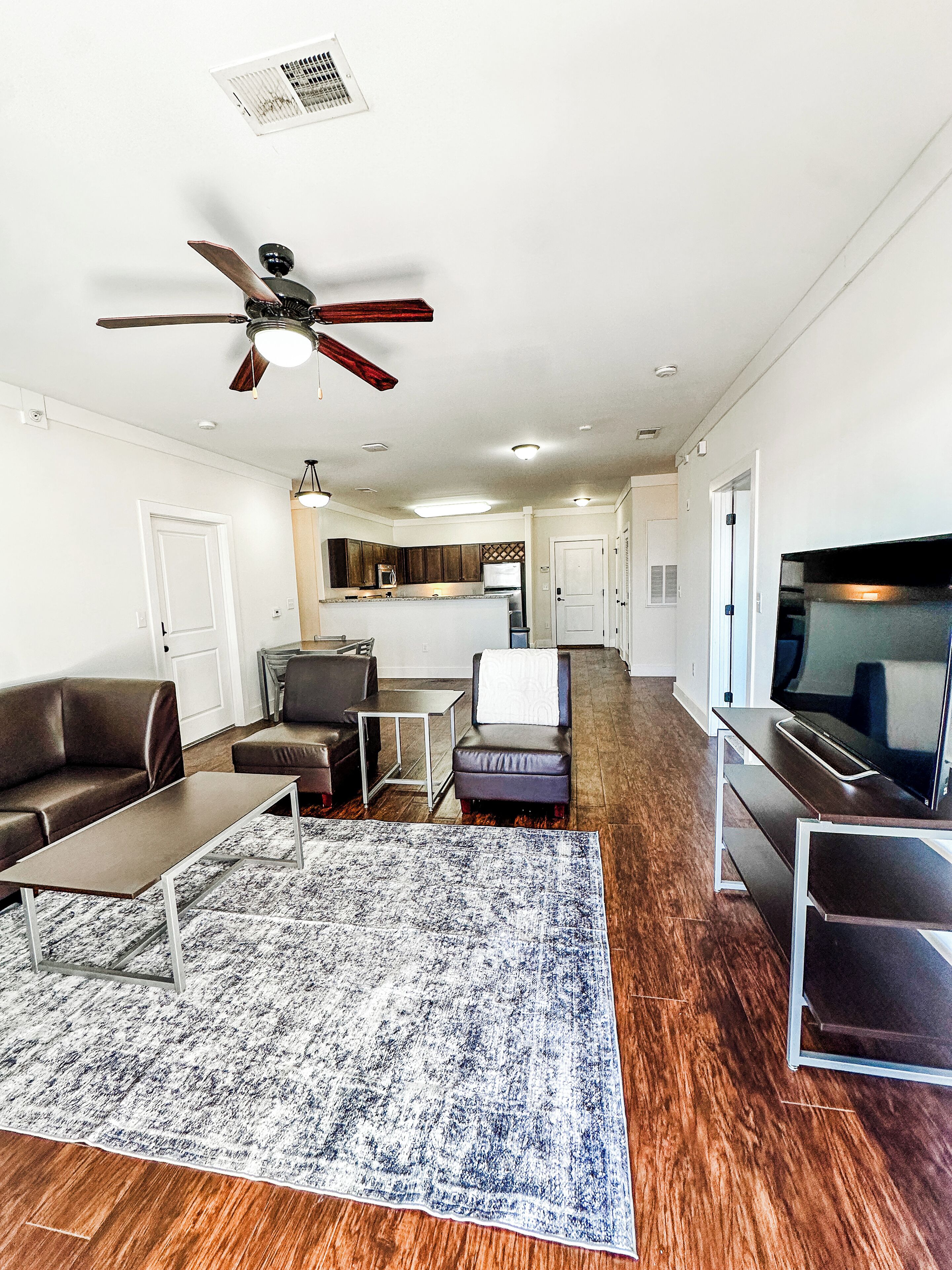 Signature Apartment, 4 Bedrooms, Pool Access | Living room | 55-inch Smart TV with digital channels