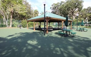 A park with a gazebo, picnic tables, and benches. - CQS 46 Veronese CT Conquistador (St. Augustine)