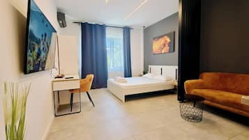 Hypo-allergenic bedding, desk, laptop workspace, blackout curtains