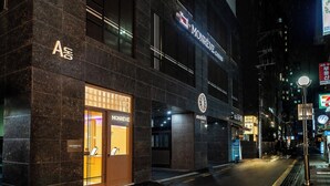 A modern building with 'MONREVE' signage, featuring a prominent entrance and a well-lit facade. - Monrêve Cabins Seoul Gangnam (Seoul)