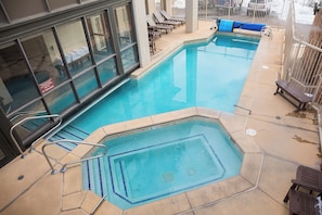 An indoor swimming pool with a diving area, lounge chairs, and a poolside bench. - CX334:  NEW LISTING! Ski-In/Ski-Out (Steamboat Springs)