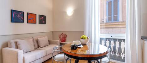 Deluxe Condo | Living area | 40-inch Smart TV with cable channels