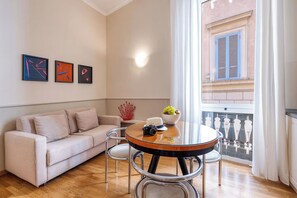 Deluxe Condo | Living area | 40-inch Smart TV with cable channels - Navona Boutique House (Rome)