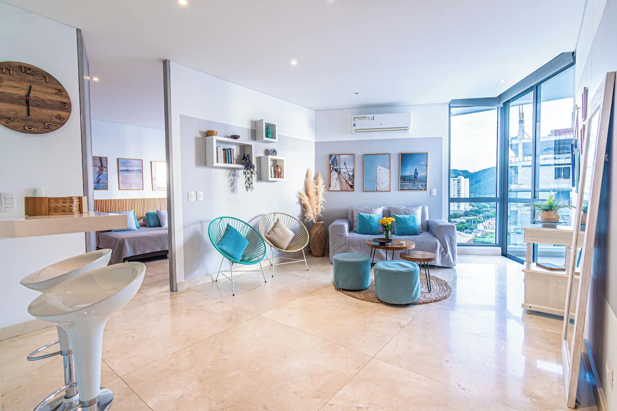 Superior Apartment, Balcony, Sea View | Living room | 55-cm flat-screen TV with digital channels