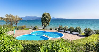 Two-bedroom apartment in a lakeside residence with swimming pool