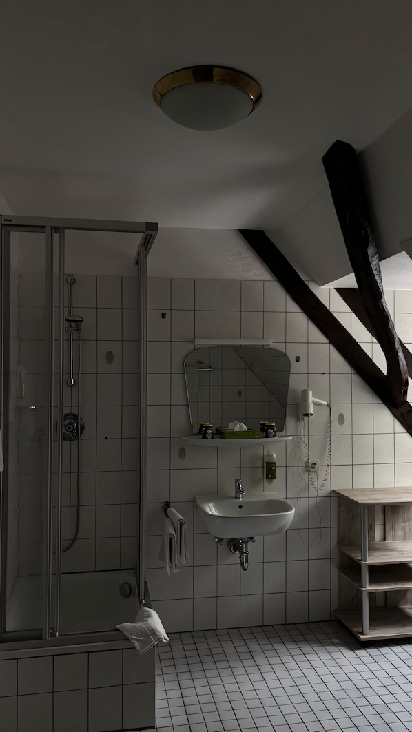 Standard Single Room, Courtyard View | Bathroom | Shower, towels, soap, toilet paper