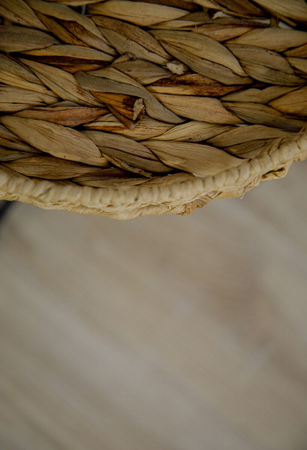 A close-up of a woven basket with a textured edge.