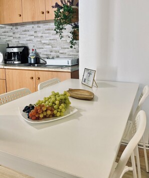 Comfort Quadruple Room, Garden View | Private kitchen | Espresso maker, coffee/tea maker, electric kettle, high chair - IRIS Garden Boutique (Ancient Corinth)