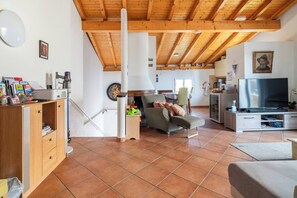 Apartment, 1 Bedroom, Smoking, Private Pool | Living room | DVD player, books - Comano Lugano Ticino - B&B Walterina (Comano)