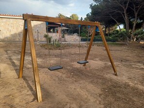 Children’s area - Five minutes from the beach, EightA cottage in private family village (Portoscuso)