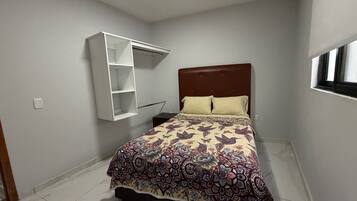 Basic Apartment, Patio, Tower | Blackout curtains, iron/ironing board, free WiFi