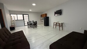 Appartement, patio, dans la tour | Coin séjour