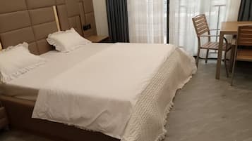 Comfort Room, Balcony, Mountain View | In-room safe, laptop workspace, blackout curtains, iron/ironing board