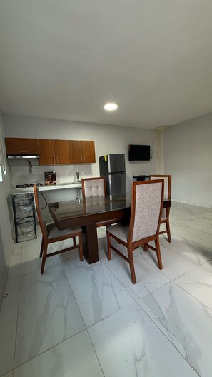 Basic Apartment, Multiple Beds, Kitchenette, Tower | Dining room - Residencia Gran Coyula Orange 512B (Tonala)