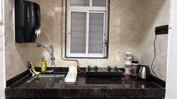 Fridge, microwave, stovetop, cookware/dishes/utensils