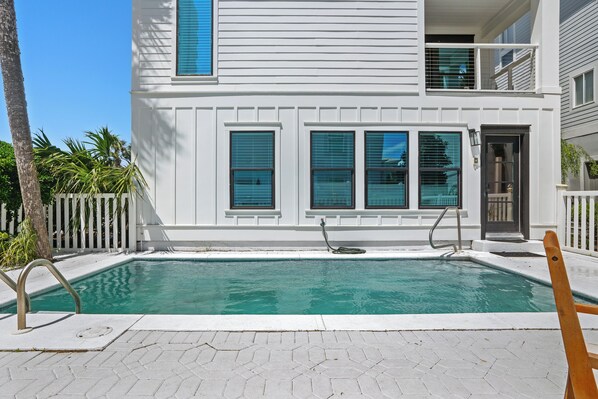 A two-story house with a swimming pool, a wooden deck, and a white picket fence. - Beach Music Gorgeous 6 Bdrm, steps to beach, 6 seater golf cart (Santa Rosa Beach)