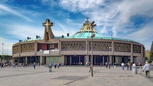 A large circular building with a green roof and a prominent cross on top. - Hotel Único La Villa (Mexico City)