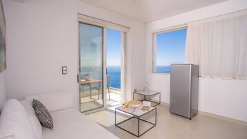 Suite, balcony,pool/sea view | Living area | 45-inch Smart TV with satellite channels, Netflix, streaming services