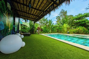 Outdoor pool, open 6:00 AM to 9:00 PM, sun loungers