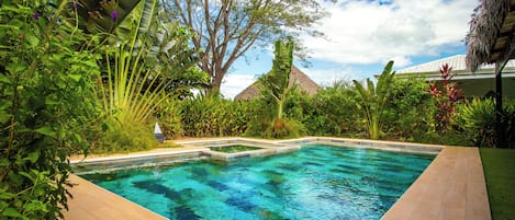 Outdoor pool, open 6:00 AM to 9:00 PM, pool loungers