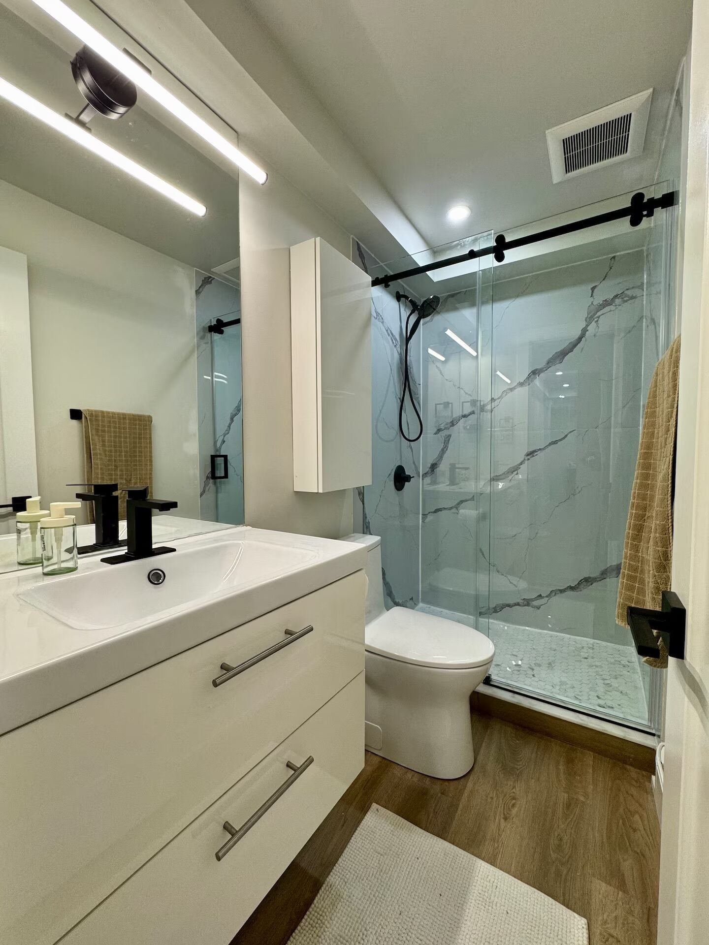 Shower, hair dryer, towels, soap