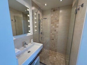 Shower, hair dryer, towels, soap