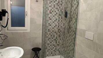 Deluxe Double Room | Bathroom | Shower, free toiletries, hair dryer, slippers