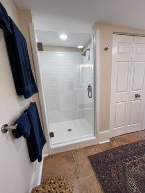 Shower, hair dryer, towels, soap - Taylor Street Inn - once an historic café - now a curated, modern designer home. (New Ulm)