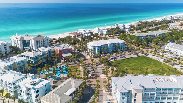A coastal resort area with beachfront properties, a central courtyard, and a view of the ocean. - Sea La Vie Corner Condo at Gulf Place Wraparound Balcony & Beach Access (Santa Rosa Beach)