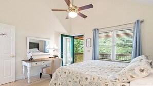 A bedroom with a bed, a desk, a chair, a ceiling fan, and a window with blinds. - Breathtaking Views for Family & Friends to Gather (Clarkesville)