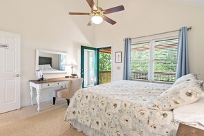 A bedroom with a bed, a desk, a chair, a ceiling fan, and a window with blinds. - Breathtaking Views for Family & Friends to Gather (Clarkesville)