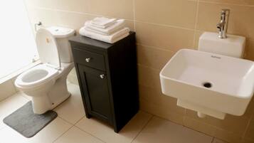 Shower, hair dryer, towels, soap