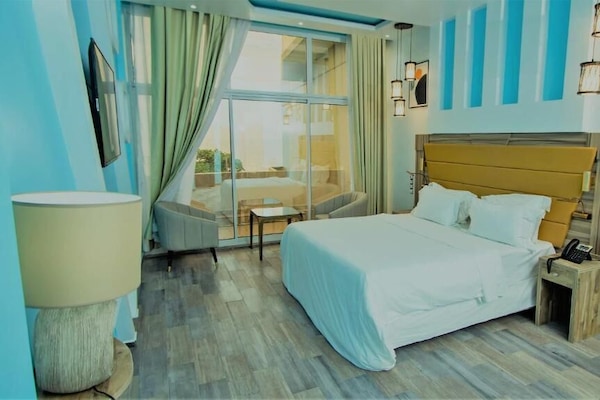 Deluxe Double Room, Balcony, Sea View | In-room safe, desk, laptop workspace, blackout drapes