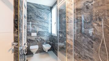 Apartment, 1 King Bed with Sofa bed, Balcony, City View | Bathroom | Shower, hair dryer, towels, soap