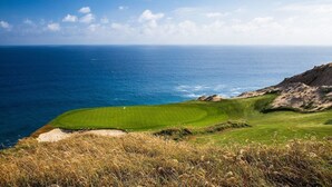 A coastal golf course with a green fairway, sand bunkers, and a flagstick. - 3-bedroom house in delightful Cabo San Lucas, AMAZING 1 week option (Cabo San Lucas)