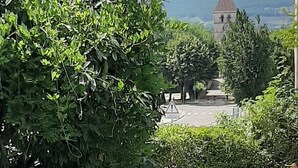 A stone bridge over a small stream, surrounded by lush greenery and a stone wall. - IDEAL FOR YOUR SPA TREATMENT IN SANTENAY (Chagny)