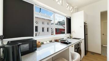 Full-sized fridge, microwave, stovetop, high chair