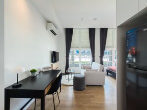 Family Studio Suite, Balcony, City View | Living area | 48-inch Smart TV with digital channels - The White House Serviced Residences  (Singapore)